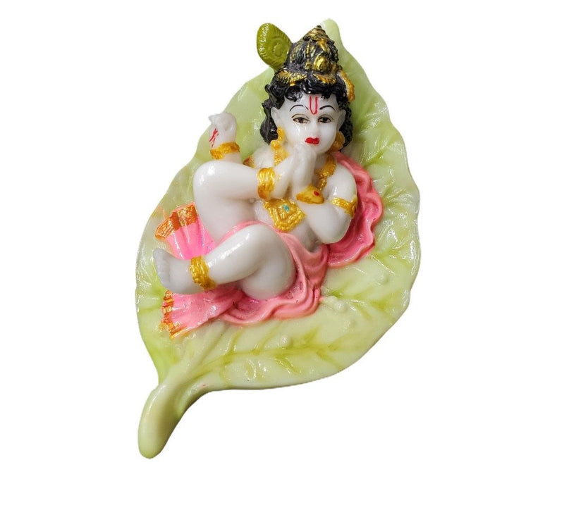 Baby Krishna on petal leaf